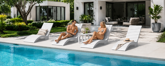 Low-maintenance pool lounge chairs beside a backyard swimming pool for easy pool days