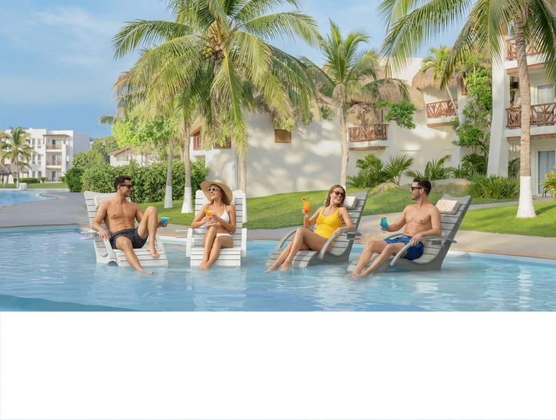 Four in-pool lounge chairs on a tanning ledge with open space for a balanced sun shelf layout.