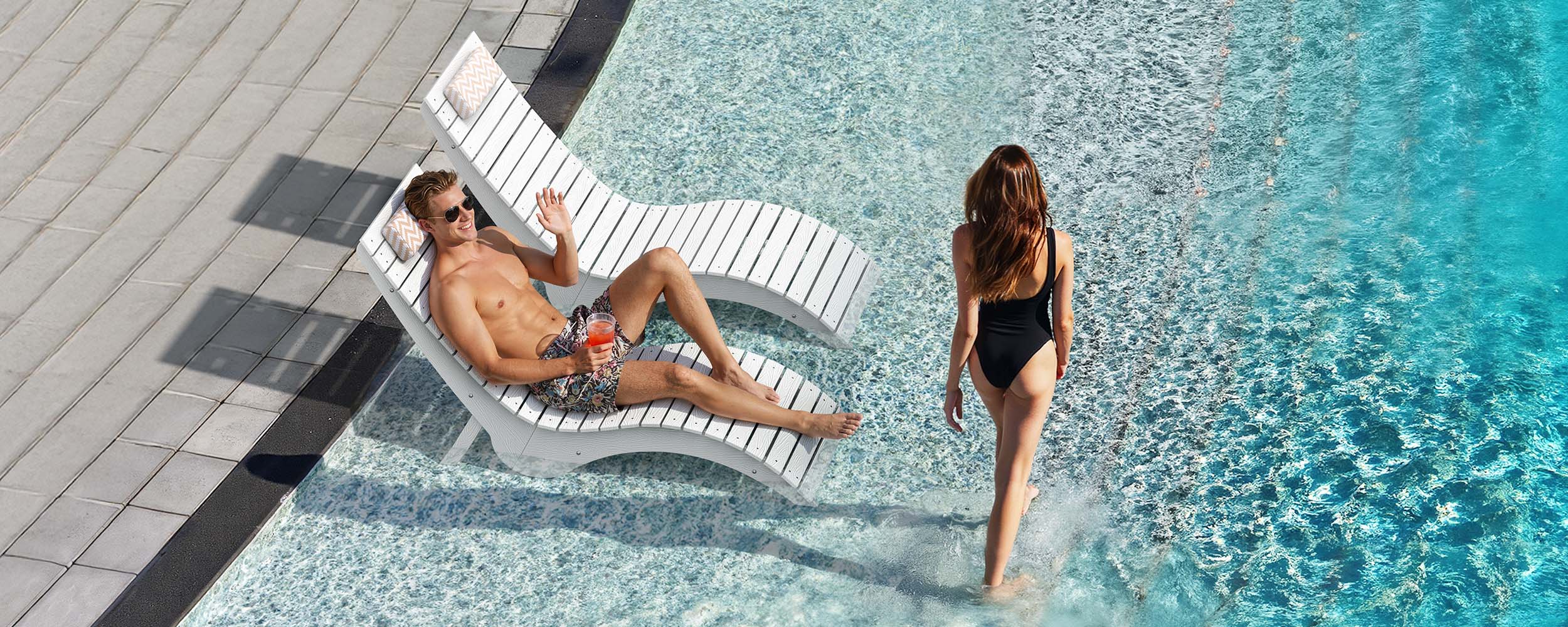 modern in-pool lounge chair positioned on a baja shelf for shallow water relaxation